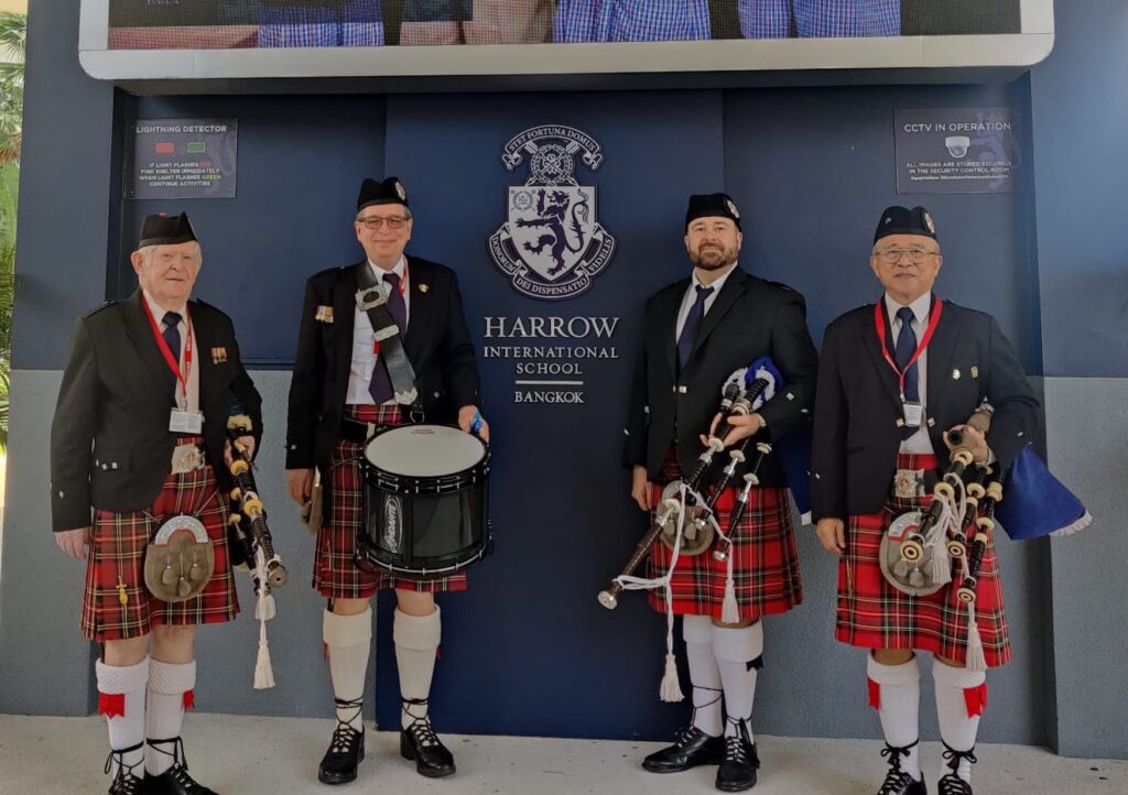 Members of the British Club Bangkok Pipe Band playing at the Harrow School in Bangkok Thailand.