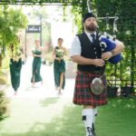 Bagpiper leading the bridesmaids at a wedding. Location: Bangkok Thailand. Piper: Wigipiper