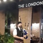 Bagpiper playing outside the Londoner Brew Pub in Bangkok Thailand
