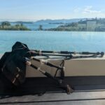 bagpipes laid down on a bench in front of a beautiful view in Koh Samui