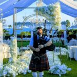 Bagpiper playing at a wedding in