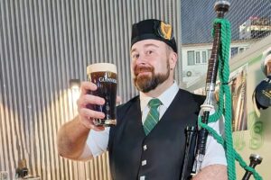 Bagpiper holding a pint in Bangkok