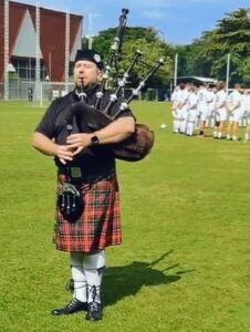 Bagpiper playing for the Alex Forbes Memorial Football Game Bangkok Thailand