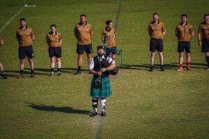 Bagpiper on field at Asian Gaelic Games, Bangkok